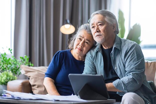 Free photo asian grandparent sit together on sofa with stress unhappy feeling home debt financial family problemold age senior couple look deperate on sofa at living room